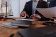 © David - Legal professionals discussing contract documents in a law firm office, analyzing clauses and providing consultation, symbolizing justice, legal advice, and agreement negotiation
