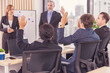 © unikyluckk - Diverse Team Working Together in Modern Co-Working Space. Casual meeting of smiling diverse business team analyzing financial data. Multiethnic business people working together in the office.