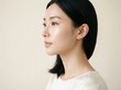 © 2Blurry - Elegant young Asian woman with clear skin and black hair in minimalist profile studio portrait
