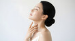 © PTC - Elegant young woman embracing a moment of tranquility, showcasing luminous and well-moisturized skin in a self-care ritual, promoting wellness and natural beauty