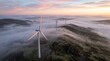 © Faruk - Aerial view of wind turbines at dawn. Renewable energy in nature setting.