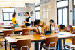 © Koldo_Studio - Diverse workers engaging in discussions and teamwork, fostering collaboration and innovation in a contemporary shared office environment