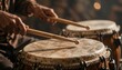 © panumas - Performer Playing Traditional Hand Drums with Wooden Sticks