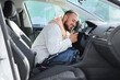 © Pixel-Shot - Handsome young man hugging steering wheel in car. I love my car concept