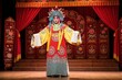 © Maryna - Actor in traditional Chinese Beijing Opera costume performs on stage. Elaborate headwear and colorful robes highlight dramatic art form. Audience watches theatrical story unfold with music and dance.