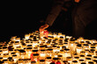 © ADDICTIVE STOCK - Candlelit cemetery vigil for All Saints Day remembrance