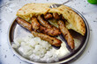 © ADDICTIVE STOCK - Traditional grilled sausages with pita and onions