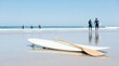 © Nina - Paddleboard and paddle on a sunny sandy beach with surfers in the ocean background