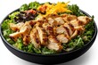 © fatman - Fresh chicken salad featuring grilled chicken, mixed greens, tomatoes, cheese, and dressing served in a large bowl at a casual dining location