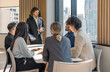 © Verin - diverse group of business people having a meeting in modern office near glass window with downtown cityscape background,corporate professionals engaged in strategy session