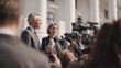 © Panachev E - Two officials in suits speak to reporters with microphones and cameras. Concept of political transparency, election campaign, and joint leadership in a democracy.