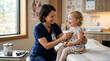 © intan - Smiling nurse with stethoscope checks happy toddler girl in doctor's office