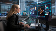 © Andrey Popov - Woman Works On Laptop Monitoring Real-time Network Security