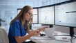 © Andrey Popov - Woman Reviews Medical Claims On Computer