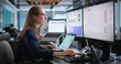 © Andrey Popov - Young Woman Reviews Data Privacy Compliance Dashboard On Laptop