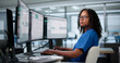 © Andrey Popov - African American Healthcare Administrator Efficiently Manages Patient Intake