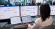 © Andrey Popov - Young Business Analyst Woman Multitasks