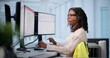 © Andrey Popov - Young African Woman Dispatcher Calmly Handling Urgent 911 Calls During