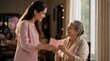 © rdkcho - Smiling woman gives a thoughtful card to an elder