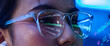 © 220 Selfmade studio - Woman glasses code reflection technology face eye screen blue programmer woman wearing clear glasses with code reflection on lens, close up face lit by blue screen glow during focused software work