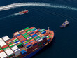 © Nasos Zovoilis/Stocksy - Container ship navigating port waters with tugboat assistance