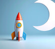 © theshooter - Cohete de juguete y luna de papel, con fondo azul. Concepto de imaginación infantil, exploración espacial, sueños, creatividad, aventura y futuro