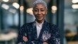 © PixelPulse Creative - Portrait of a confident senior businesswoman with short grey hair standing in a modern office with arms crossed