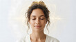 © aditya - Young woman meditating with eyes closed in peaceful relaxation. Serene female face portrait for wellness, mindfulness, and mental health concepts.