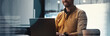 © Prostock-studio - Smiling Young Caucasian Male Working On Laptop In Modern Office Environment, Engaged In Task, Showcasing Professionalism And Positive Attitude In Corporate Setting, Business Concept.