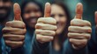 © Kaafin - Diverse group giving thumbs up, outdoor setting, teamwork concept, website banner
