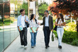 © EFStock - University student friends walking together with Professor, talking in the college campus