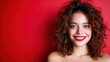 © svastix - A vibrant portrait of a smiling woman with curly hair set against a bold red background, capturing her joyful expression and radiant personality in an artistic context.