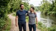 © Ally_art - Dad and son walking together on a path by the river. Bonding, nature, outdoor recreation, family lifestyle and male connection.