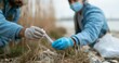 © Anastasiya Marchenko - Scientists collecting environmental samples outdoors