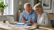 © Svitlana - Senior Couple Reviewing Household Finances Together