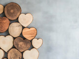 Assortment of natural wood slices carved into heart shapes for crafts