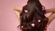 © pornsawan - Pink flower on long hair of beauty woman in studio,spring or summer concept,creative bright image for advertising products for hair,copy space,sakura,cherry blossom,Bridal hairstyle with real flowers.