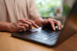 © eggeeggjiew - Man types on a laptop to access an online application, highlighting secure registration, digital authentication, remote work, and modern business communication.