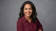 © Digital soul - Confident middle-aged businesswoman smiling at camera. Professional woman in business attire exuding positivity and success.