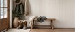 © Nattapun - Charming winter entryway design featuring cozy boots scarves and natural elements for a welcoming atmosphere