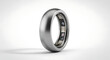 © Hassan - A close-up of a metallic ball bearing ring displayed against a neutral gradient background.