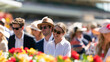 © Dimas - Elegant people enjoying the festive atmosphere at the annual Spring Racing Carnival outdoor horse racing event on a sunny day