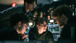 © Visual Studio - Diverse team of programmers collaborating in futuristic office workshop analyzing data on computer screens with cybersecurity monitoring