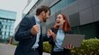 © Yuliia - Caucasian business woman man happy winners look laptop celebrate online in city successful colleagues wireless computer shock success partners victory internet achievement businessman businesswoman
