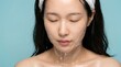 © XiangAn - Young asian woman rinsing face with water for daily skin care skincare wellness treatment