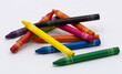 © Ayaoic - Pile of colorful wax crayons on white background