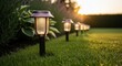 © DigitalSpace - Lowangle view of solar stakelights embedded in a garden lawn highlighting design and functional outdoor illumination.