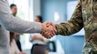 © Karan - Firm handshake between soldier in camouflage uniform and civilian man in professional office with handshake, camouflage