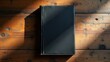 © rahwik - top down view aged black leather journal on rustic wood surface natural daylight soft shadows for academic writing mockup sophisticated branding background