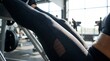 © Bboy - Close Up of Athletic Woman Legs Performing Leg Press Workout in Gym